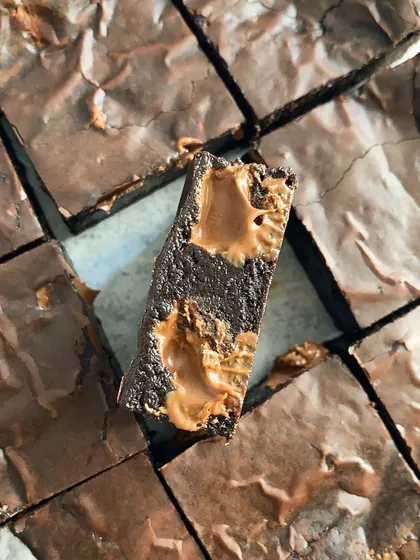 A single bite-sized piece of my gooey fudgy brownie with a Biscoff topping. The combination of rich chocolate and spiced cookie butter is simply divine.