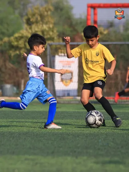 A young player from our U7 team dribbling past a defender in the Leno Premier League.
