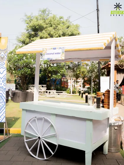 A charming coconut water cart, providing a refreshing and healthy drink option for guests at an outdoor Haldi.