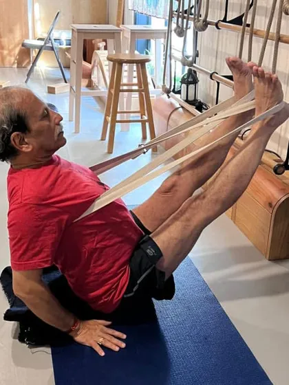 Navasana with a strap at Yoga Kurunta.