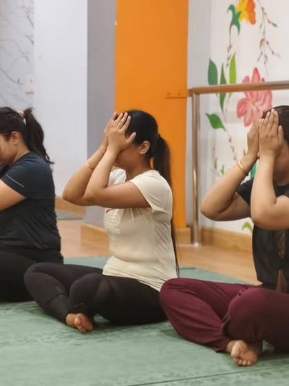 A moment of collective calm as our class practices Bhramari Pranayama. This simple breathing technique is a powerful tool for reducing stress and clearing the mind.
