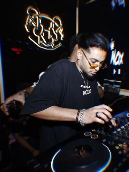 Another angle of me working the turntables. The focus is on precision and creativity, ensuring every transition is smooth and every track builds the atmosphere.