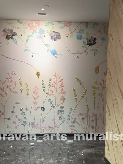 This delicate floral mural in an ultra-luxurious apartment was created using a piping technique. It gives the flowers and vines a subtle 3D effect, almost like embroidery on the wall.