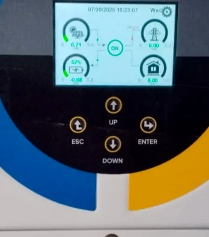 A detailed look at the inverter's display screen at the V.R. Public School installation. This smart monitoring system allows the school to track real-time energy generation, consumption, and battery status.