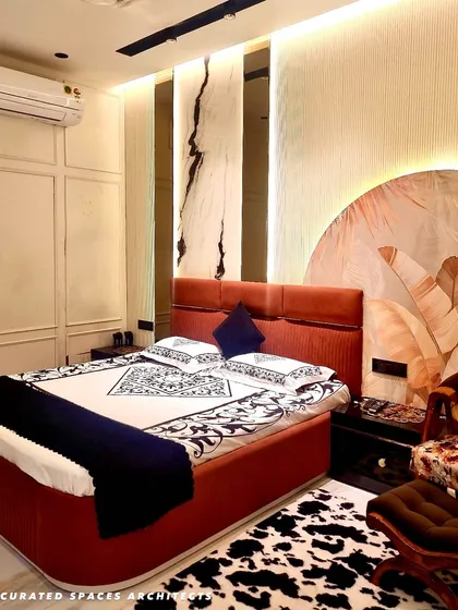 I love creating luxurious master bedrooms that feel like a personal sanctuary. This design combines multiple textures, from the fluted headboard and custom wallpaper to the dramatic marble-patterned wall panels with integrated backlighting, for a truly gorgeous result.