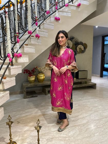A full look of the pink and blue kaftan suit I designed from my mom's old saree, seen here in our home decorated for Diwali.