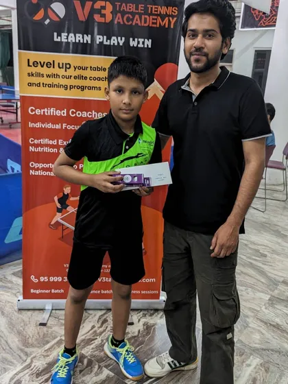 A young player being recognized for his performance. My tournaments are a platform for players to gain exposure and experience the thrill of a real match.