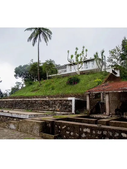 The 'Malenadu Mane' is designed to be one with its environment. Situated on a hill within a coffee plantation, its form is a direct response to the topography and views, creating a seamless relationship between the built structure and the surrounding habitat.