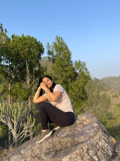 A candid smile on a mountain trail. These retreats are about finding joy in the journey, not just the destination.