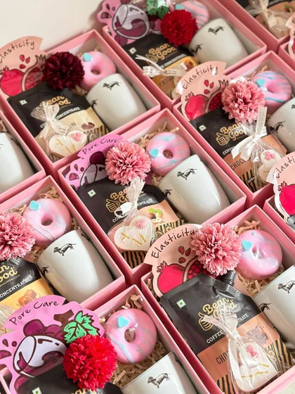 I love how these pink boxes for a baby celebration turned out. The mix of practical items like mugs and fun treats like donut soaps is always a hit.
