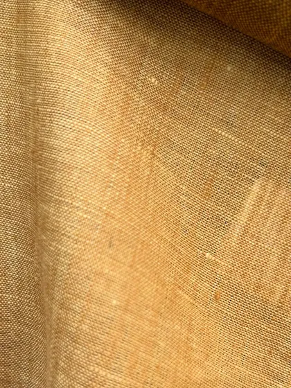 A rich, mustard-yellow linen swatch, perfect for a bold and stylish summer statement piece.