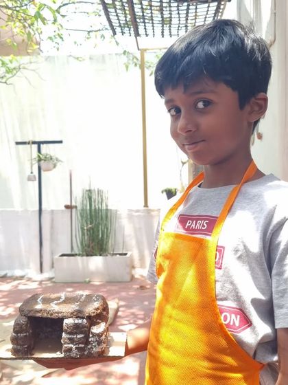 A young creator with his impressive clay cave. Our single pinch pot animal and structure projects are always a hit with the kids.