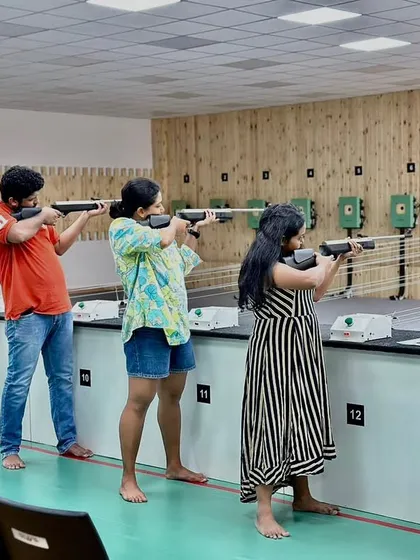 A group of friends lines up for an air rifle session, showcasing a perfect activity for a fun shooting day out. Our spacious lanes allow groups to learn and practice together in a relaxed and friendly environment.
