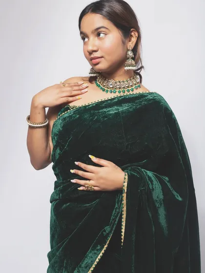 A classic pose for an ethnic wear lookbook, showcasing the drape and design of the saree. My direction ensures the model's posture is graceful and confident.