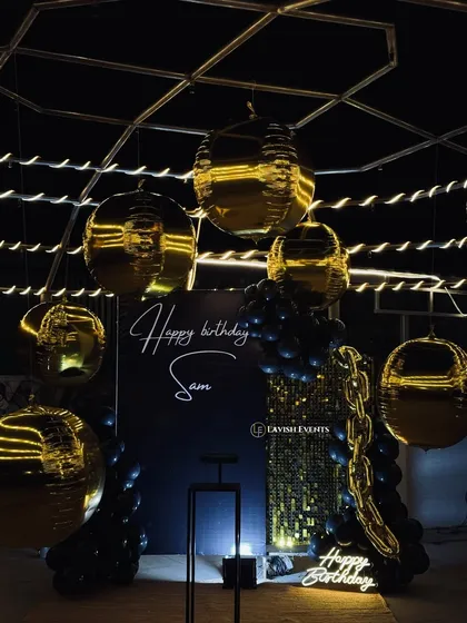 For those who love a touch of drama and sophistication. This black and gold themed birthday bash features a stunning backdrop, neon signs, and metallic balloons for a truly glamorous night.