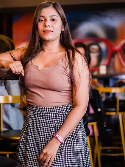 A guest posing at the bar.