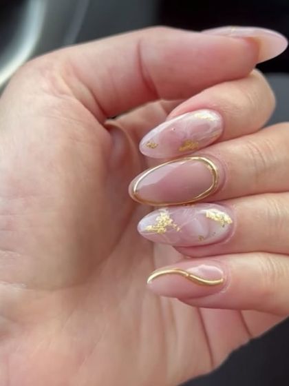 A beautiful and elegant design with a pink marble effect and delicate gold foil and chrome accents.