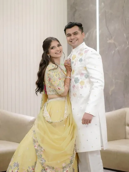 A lovely couple portrait from their engagement day. Her makeup look is clean and radiant, with a soft hairstyle that keeps the focus on her happy, glowing expression.