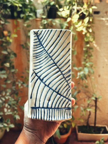 Congratulations to this student on completing her beginner's course. She created a beautiful collection, including a tall vase with leaf imprints and a lovely coiled bowl.