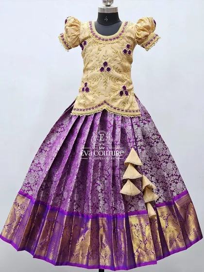A similar design in a different color, with a beige blouse and a purple Banarasi skirt.