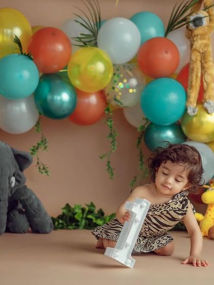 A quiet moment before the smash. Even in a playful setting, I look for these sweet, thoughtful expressions that show your child's personality.