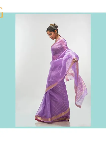 This image captures the flowing elegance of the African Violet organza saree, highlighting its lightweight feel and the beautiful way it drapes.