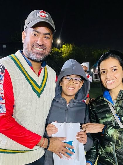 A player celebrates with his family after the tournament. We encourage family support, which makes the victory even sweeter.