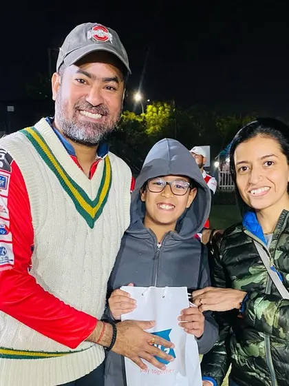 A player celebrates with his family after the tournament. We encourage family support, which makes the victory even sweeter.