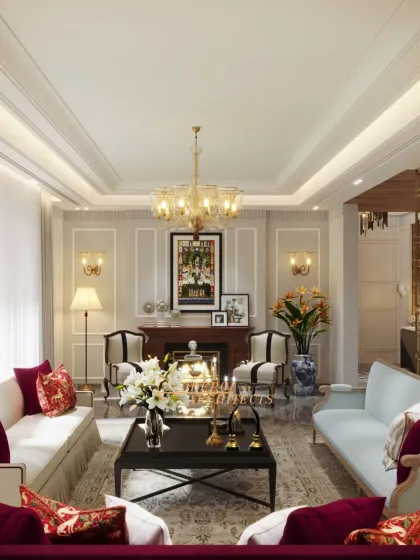 A wide shot showing the complete living room layout, including a fireplace and multiple seating arrangements for large gatherings.