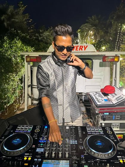 A focused shot of me at the console during a night Baraat. The mobile setup is fully equipped for any time of day.