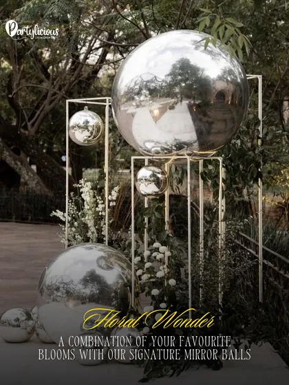 Floral Wonder. A beautiful combination of our signature mirror balls with fresh blooms and modern metal structures for a sophisticated outdoor installation.