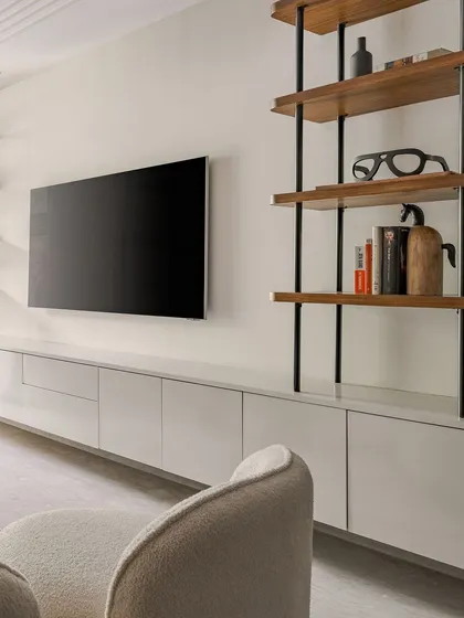 Another angle of the TV and shelving unit, showing how it integrates seamlessly into the living room's overall design.