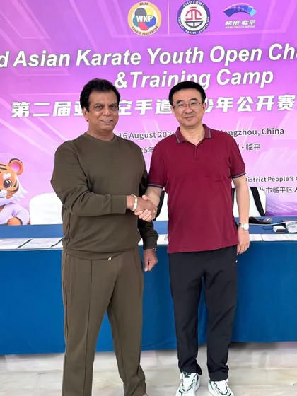 Shaking hands with the President of the Chinese Karate Federation. Building strong bilateral ties helps create more opportunities for our athletes.