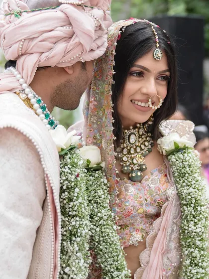 A sweet, candid moment between the couple. Tanisha’s natural makeup look allows her joyful expressions to be the focus.