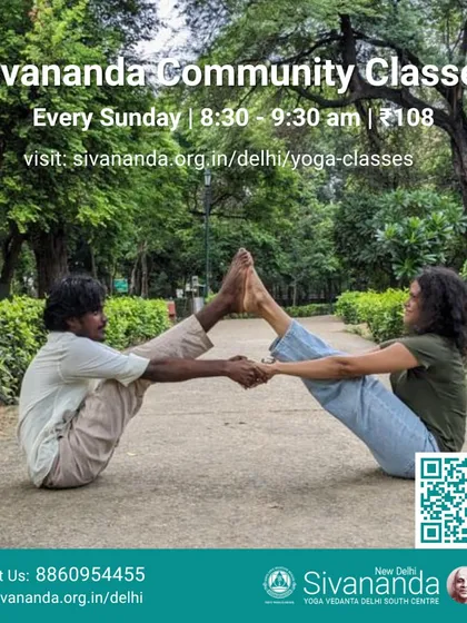 Our community classes are an invitation for everyone to experience the joy of yoga. This image shows a partner variation of Navasana, or Boat Pose, reflecting the connection and support that are central to our satsang.