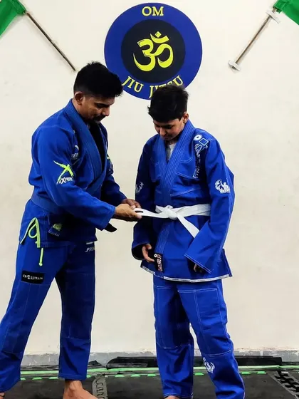 Promotion day is about acknowledging progress. This isn't just a stripe; it's a symbol of how much this student has improved physically, technically, and mentally.