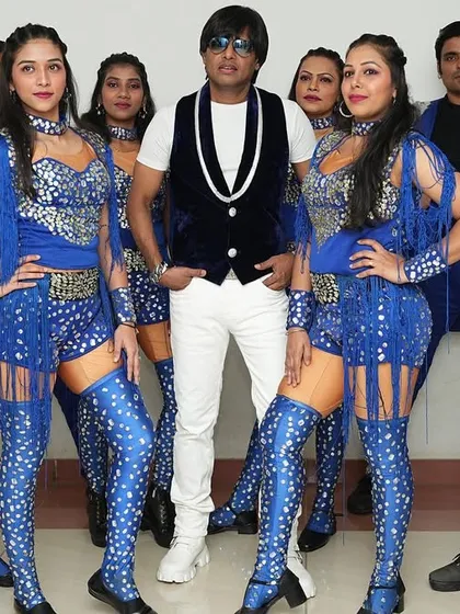 My core dance team in their stunning blue costumes. Their professionalism and talent are the backbone of the show.