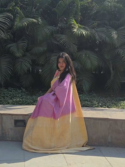 This pose shows the full length and beautiful fall of the Kanjivaram silk. Styling is also about finding the perfect photo opportunities to capture the essence of your outfit.