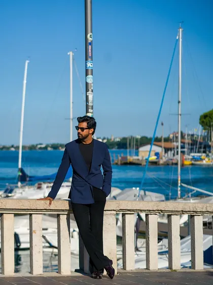 A relaxed moment by the marina in our navy lapel-free blazer.
