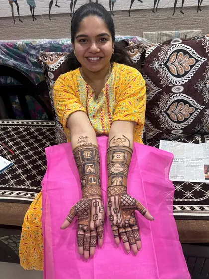 A happy client showing off her full baby shower mehndi. We did this at her home, making sure she was comfortable while we created this special design for her.