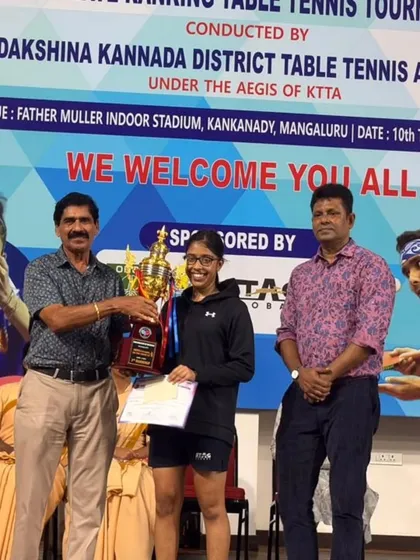 Another proud moment for Kaira Baliga as she receives her winner's trophy at the 3rd State Ranking Table Tennis Tournament held at the Father Muller Indoor Stadium in Mangalore.