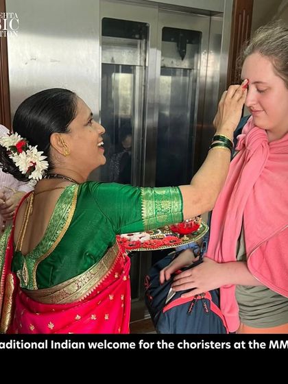 A member of the Ulmer Spatzen Choir receives a traditional Indian welcome at our foundation, marking the beginning of a wonderful musical partnership.