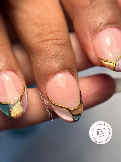 A close-up of the stained-glass nail art, highlighting the clean gold lines and the blend of colors underneath. This technique adds depth and dimension to the nails.