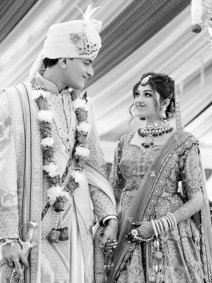 A beautiful black and white shot of the couple during their wedding ceremony, their expressions full of love and admiration for each other.