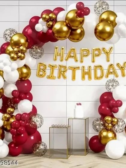 A classic and bold birthday decoration featuring a balloon arch in red, white, and gold chrome. The "Happy Birthday" foil letters in the center make a clear and festive statement.