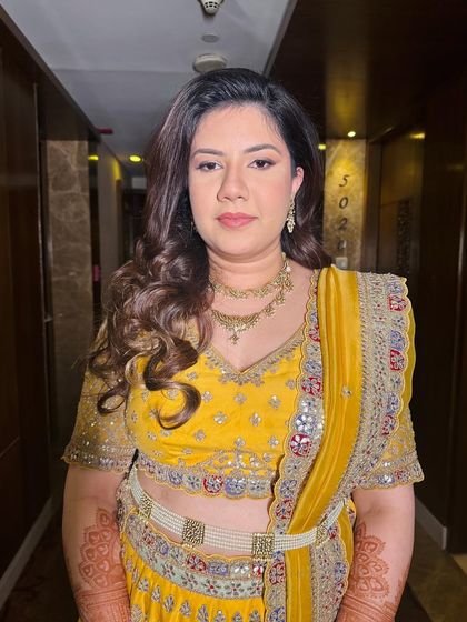 A close-up of the soft, minimalistic makeup. The focus is on healthy, glowing skin and softly defined features.