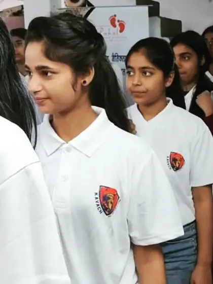 A lineup of confident young girls in their Kavach branded t-shirts after their training.