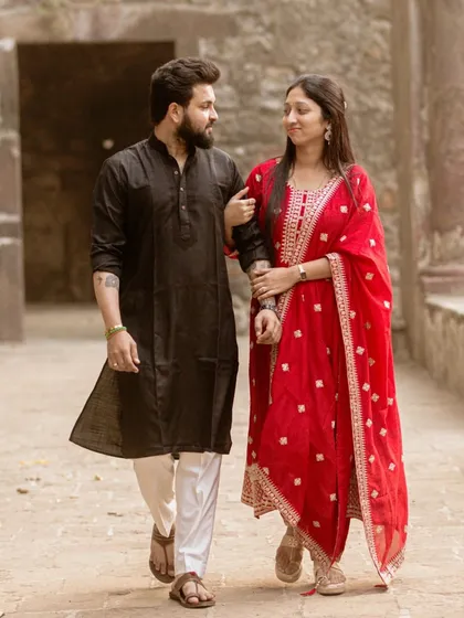 A candid shot of the couple walking and talking. I aim to capture the natural chemistry and friendship between them.