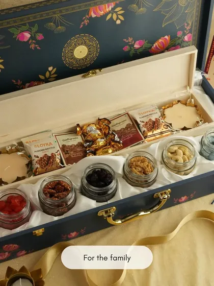 An elegant and traditional hamper, perfect for family gifting during festivals. This beautiful floral box is filled with premium dry fruits and chocolates, designed to be shared and enjoyed by everyone. It’s a sophisticated way to send festive wishes.