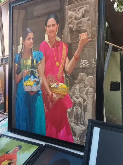 Another one of my large, framed paintings from the Chithra Santhe exhibition. This work depicts two women against a backdrop of temple carvings, exploring cultural themes and detailed traditional attire.